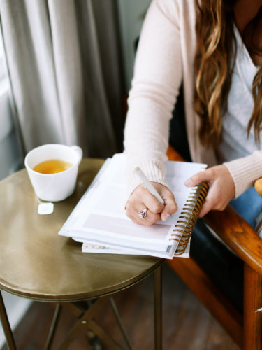 Woman Writing in Notebook