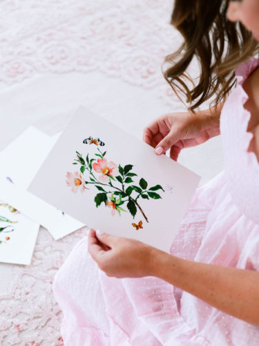 Woman Holding Card with Flower