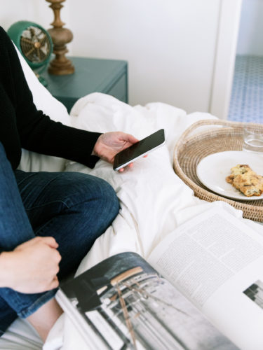 Woman Texting in Bed