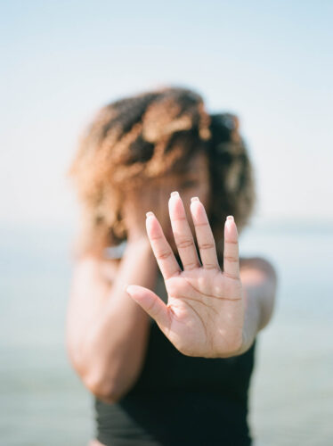 Woman holding out her hand to say no