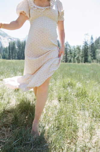 woman walking in meadow