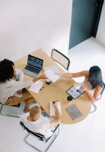 overhead view of women working around table